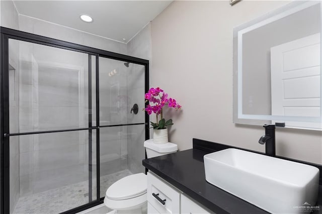 1712 B St, Mission, TX 78572 - bathroom with toilet, a stall shower, vanity, and recessed lighting
