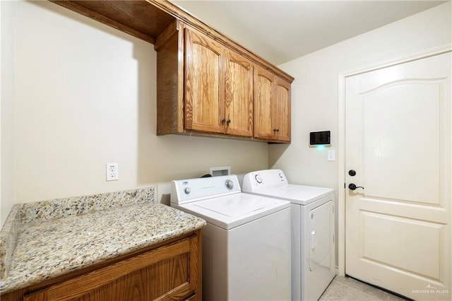 2017 Stonebriar Rd, Harlingen, TX 78552 - laundry area featuring cabinet space and washing machine and dryer