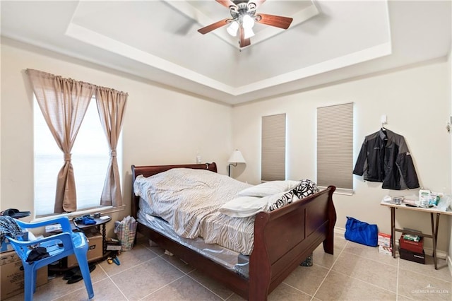 2017 Stonebriar Rd, Harlingen, TX 78552 - bedroom with a raised ceiling, tile patterned flooring, and ceiling fan