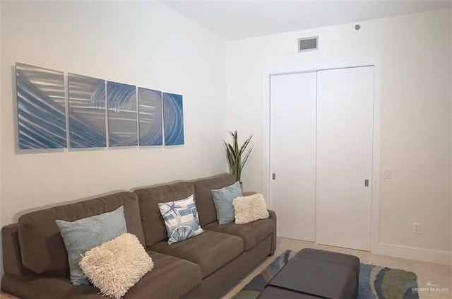living room with visible vents and baseboards