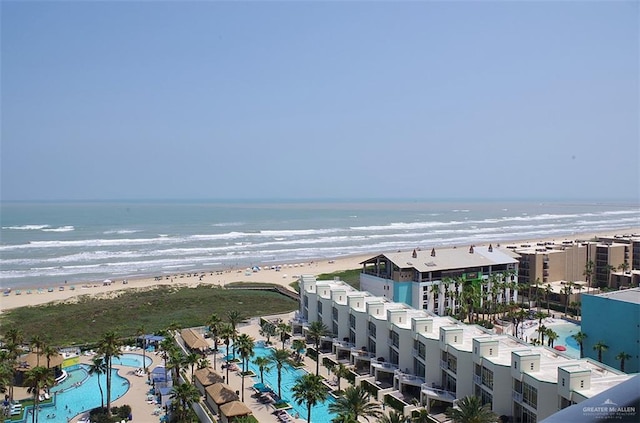 drone / aerial view with a water view and a view of the beach