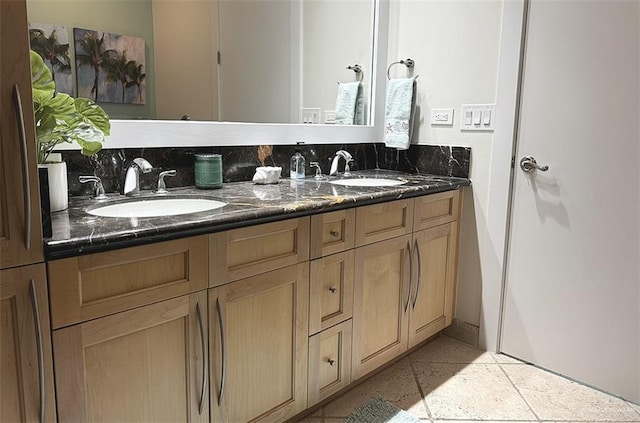 full bathroom featuring double vanity and a sink