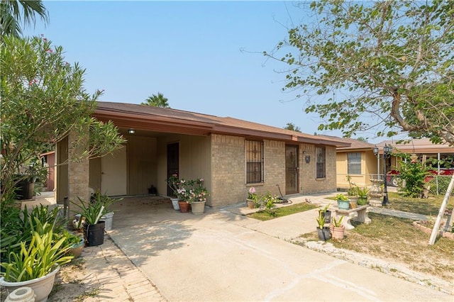 2512 Dallas Ave, Mcallen, TX 78501 - view of front of home featuring driveway and brick siding