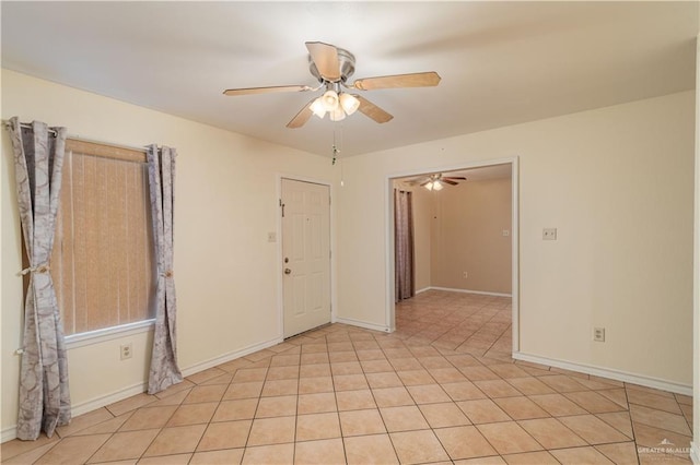 2512 Dallas Ave, Mcallen, TX 78501 - empty room featuring a ceiling fan, baseboards, and light tile patterned flooring