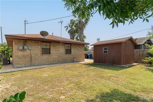 2512 Dallas Ave, Mcallen, TX 78501 - rear view of house with central air condition unit and brick siding