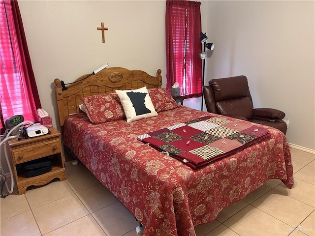 bedroom with tile patterned floors