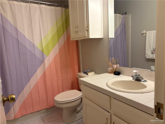 bathroom with toilet, tile patterned flooring, vanity, and a shower with curtain