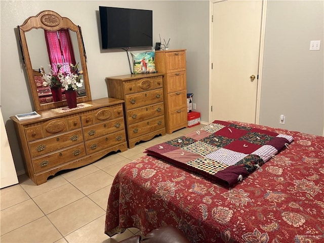 bedroom featuring light tile patterned floors