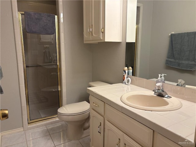 bathroom featuring toilet, a stall shower, tile patterned floors, and vanity