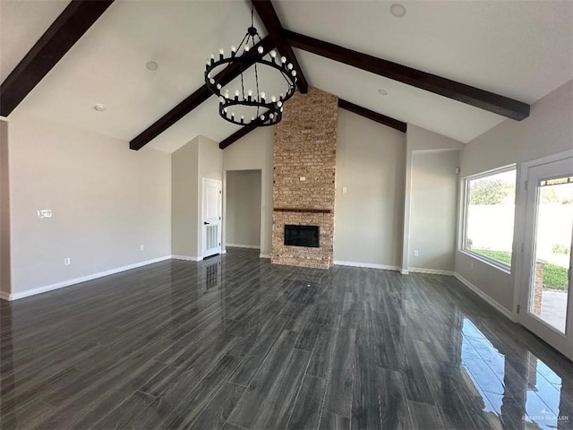 unfurnished living room with a stone fireplace, dark hardwood / wood-style flooring, beamed ceiling, and high vaulted ceiling