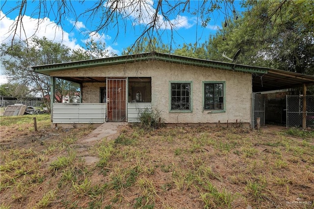 view of front of house with a carport