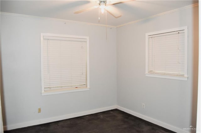 spare room featuring ceiling fan and crown molding