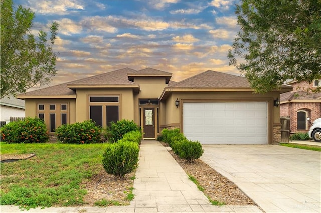 prairie-style house featuring a garage