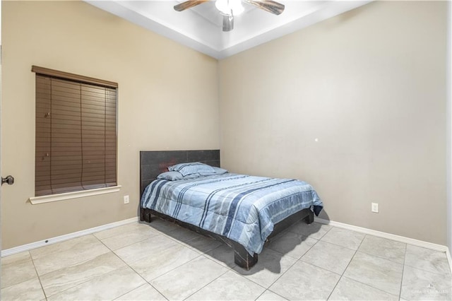 tiled bedroom with ceiling fan