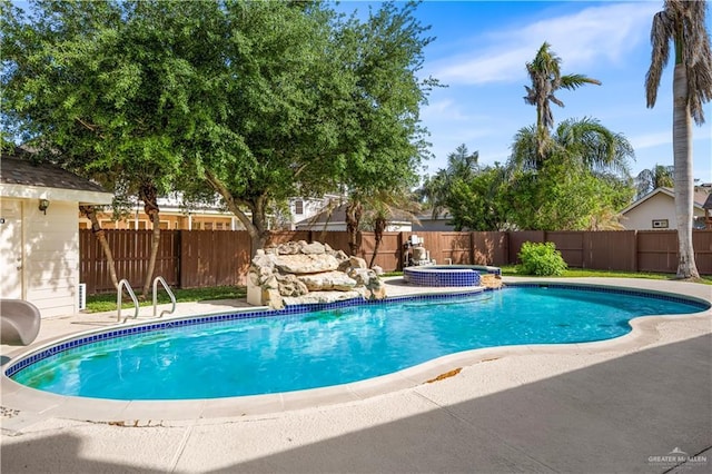 view of pool with a fenced backyard, a patio, a fenced in pool, an in ground hot tub, and a water slide