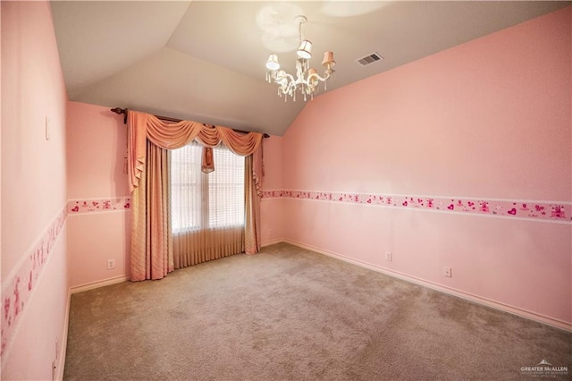 carpeted empty room featuring lofted ceiling, visible vents, and a notable chandelier
