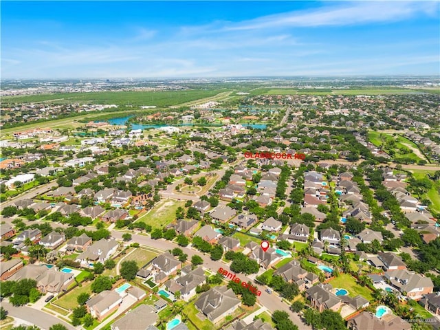aerial view featuring a residential view and a water view
