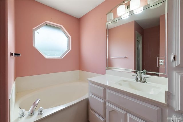 full bathroom featuring vanity and a bath