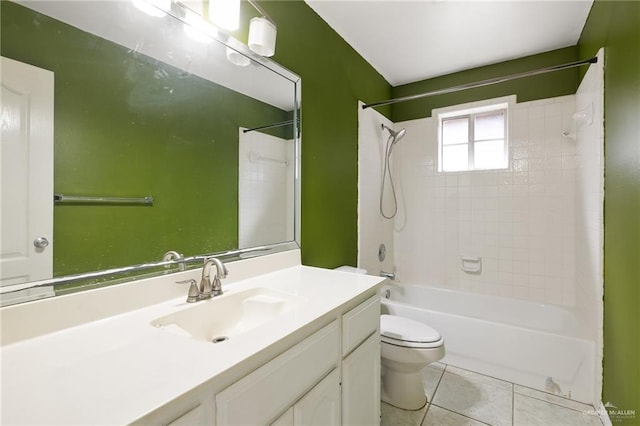 bathroom featuring vanity, shower / washtub combination, tile patterned flooring, and toilet