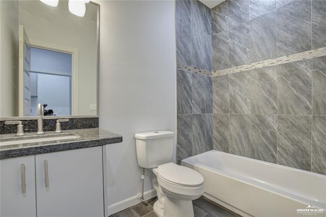 1520 New Orleans Cir, Pharr, TX 78577 - bathroom featuring vanity, baseboards, wood finished floors, and toilet