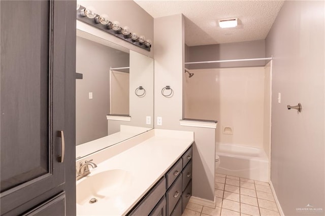 bathroom with tile patterned flooring, vanity, shower / bathtub combination, and a textured ceiling