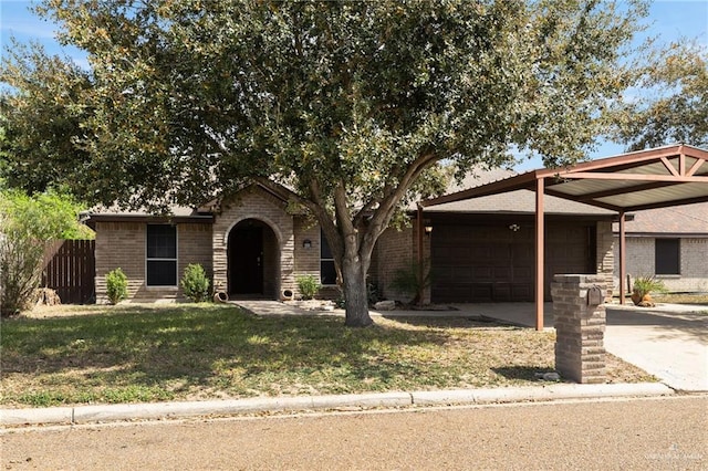 ranch-style home featuring brick siding, a garage, concrete driveway, and a front lawn