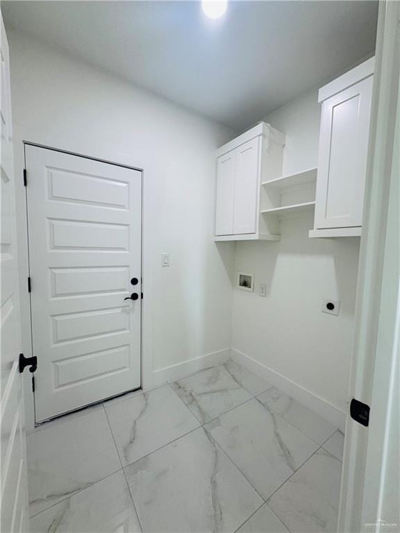 washroom featuring baseboards, washer hookup, cabinet space, electric dryer hookup, and marble finish floor