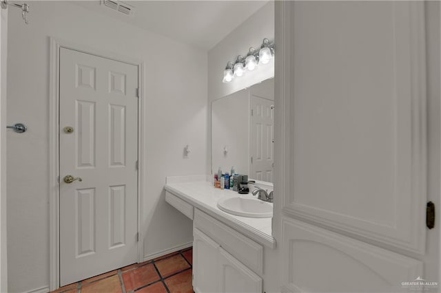 bathroom featuring tile patterned flooring and vanity