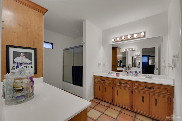 bathroom featuring vanity, tile patterned floors, and a shower with shower door