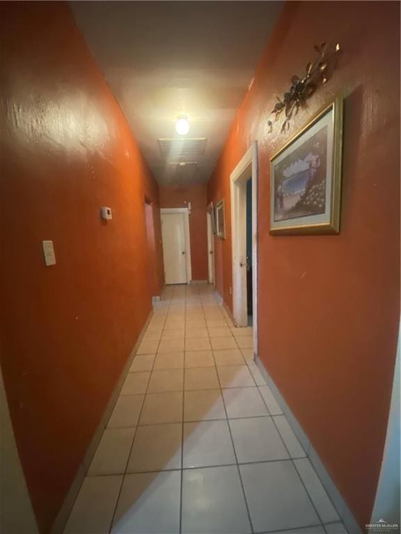 hallway featuring light tile patterned floors