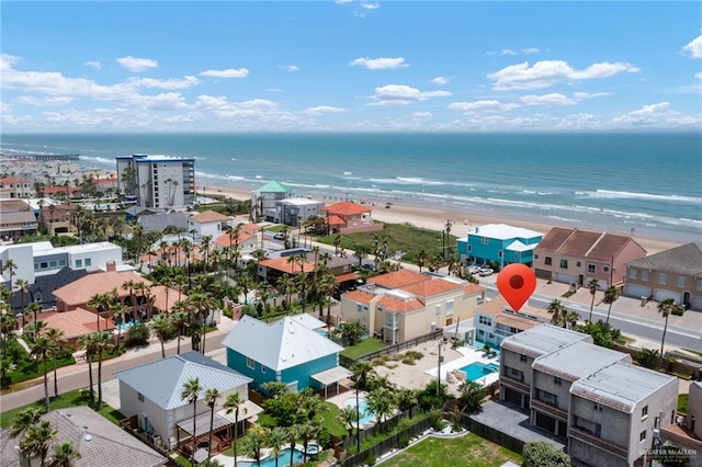 aerial view with a water view and a beach view