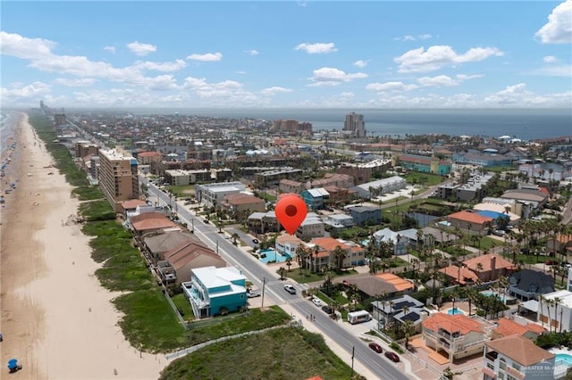 aerial view with a water view and a beach view