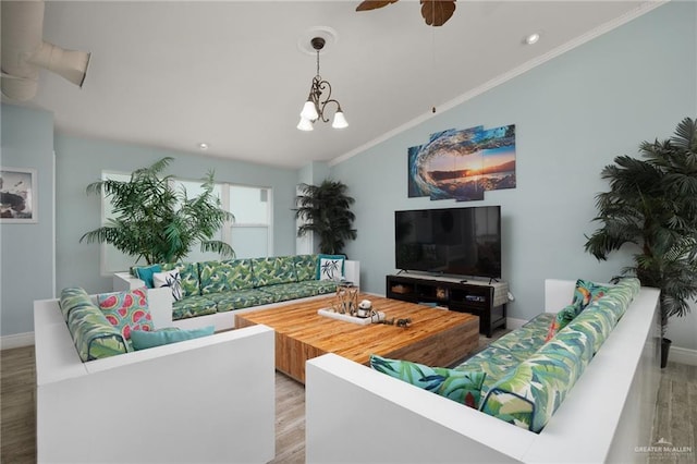 living room featuring ceiling fan with notable chandelier, crown molding, and light hardwood / wood-style flooring