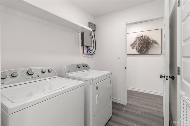 clothes washing area featuring washer and clothes dryer