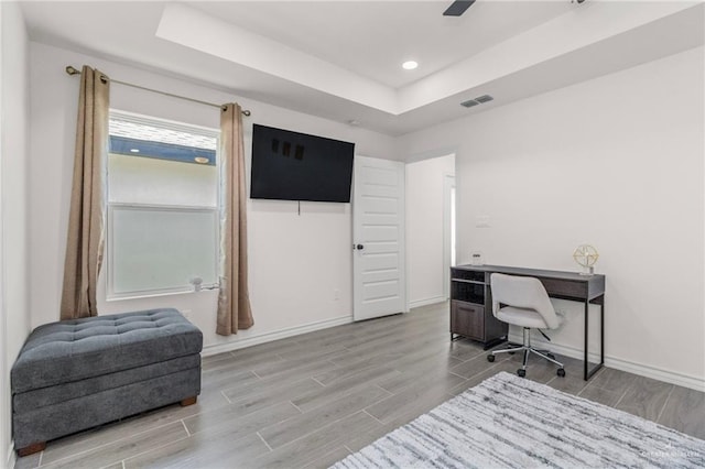 home office with a raised ceiling