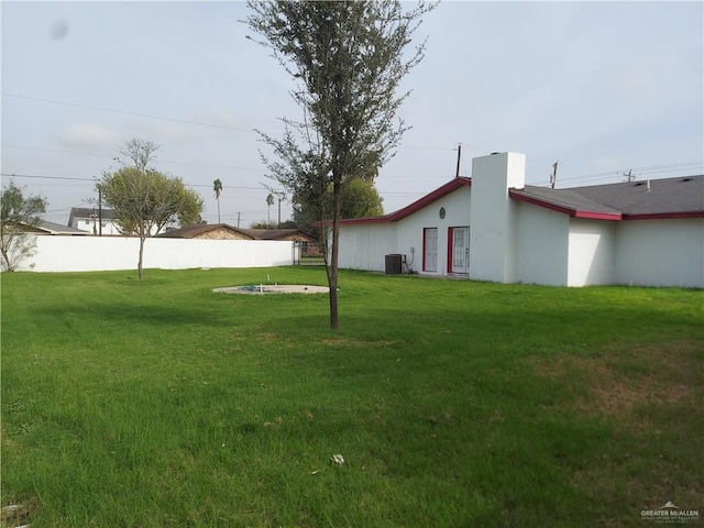 view of yard with central air condition unit