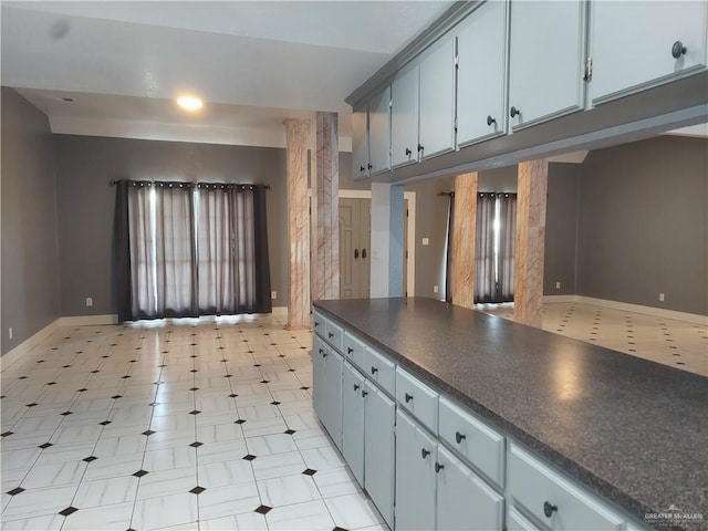 115 Breyfogle Rd, Palmview, TX 78572 - kitchen featuring dark countertops, baseboards, and light floors