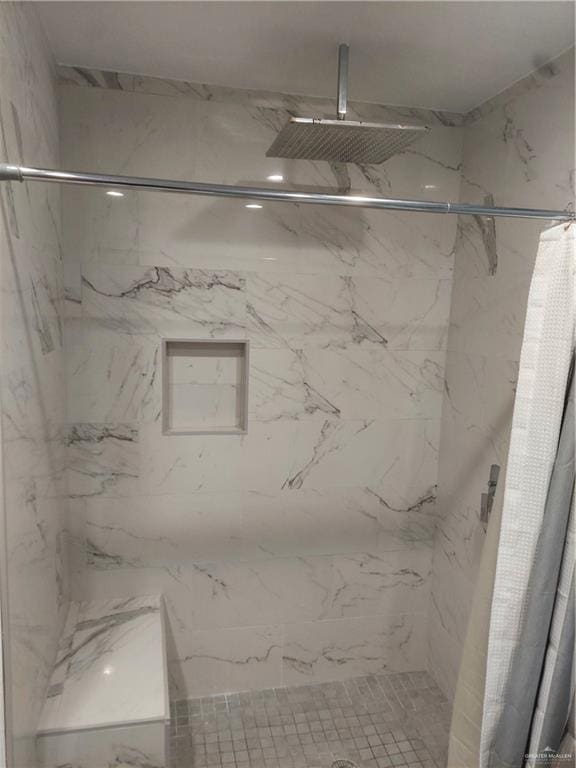 115 Breyfogle Rd, Palmview, TX 78572 - full bathroom featuring a marble finish shower