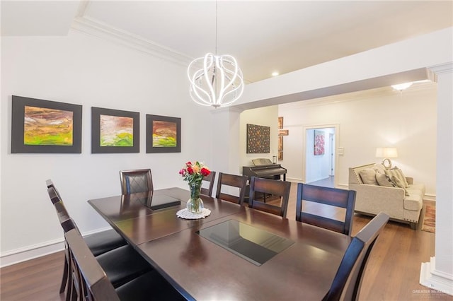 dining space with ornamental molding, dark hardwood / wood-style flooring, and a notable chandelier