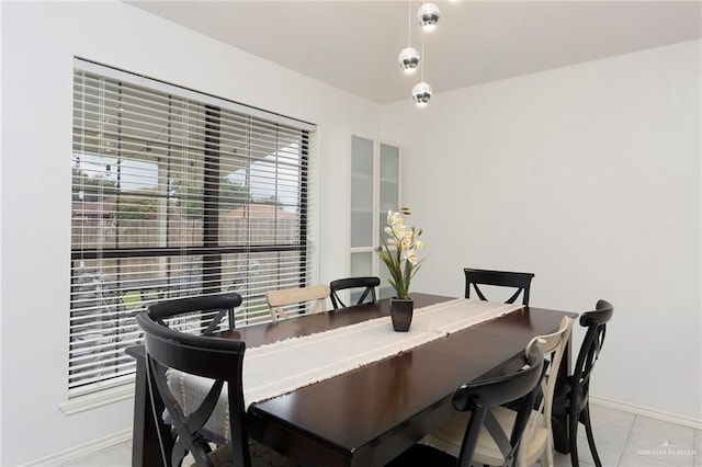 dining area featuring light tile patterned flooring