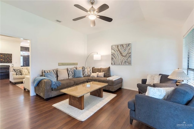 living room with dark hardwood / wood-style floors and ceiling fan