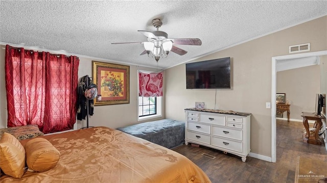 bedroom featuring lofted ceiling, dark wood-type flooring, ceiling fan, ornamental molding, and a textured ceiling