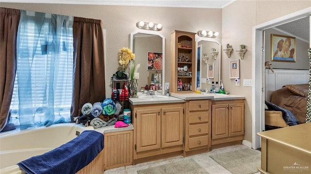 bathroom featuring a washtub and vanity