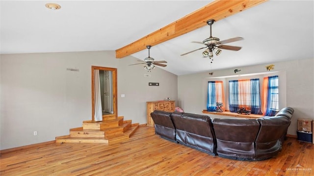 living room featuring lofted ceiling with beams, ceiling fan, and light hardwood / wood-style flooring