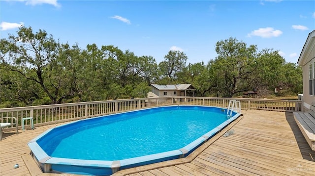 view of pool with a deck