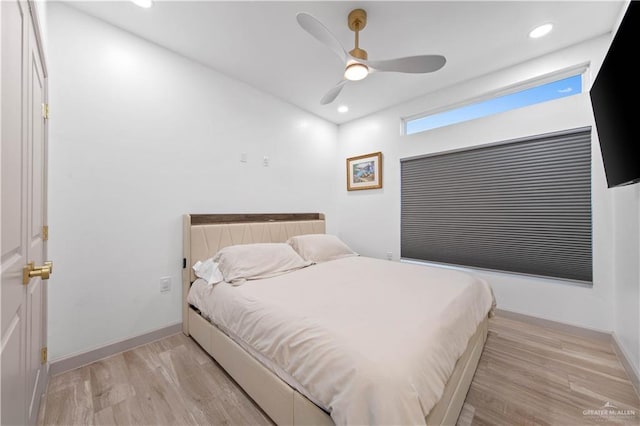 bedroom featuring recessed lighting, light wood finished floors, baseboards, and ceiling fan