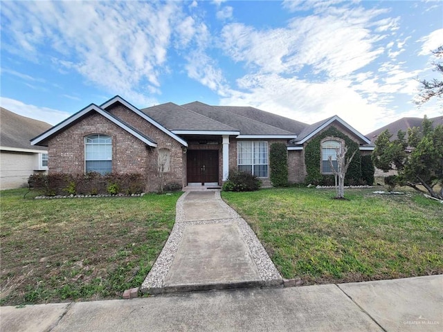 ranch-style house with brick siding and a front lawn