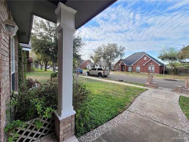 view of yard featuring a residential view