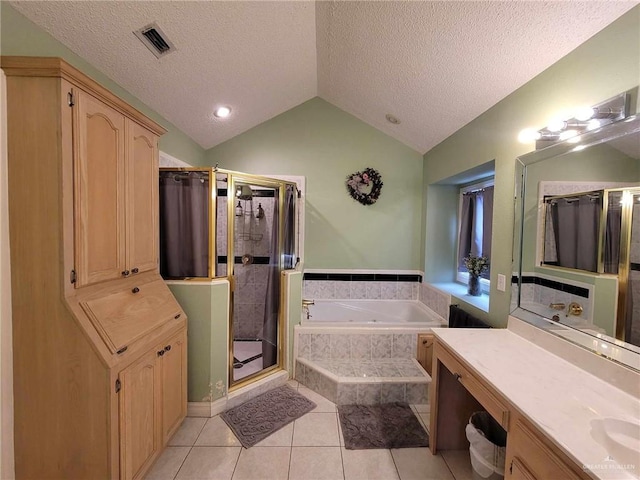 full bath with visible vents, a garden tub, lofted ceiling, a stall shower, and tile patterned floors