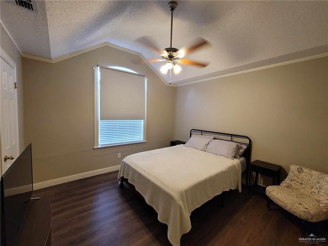 bedroom featuring visible vents, crown molding, vaulted ceiling, dark wood-style floors, and a textured ceiling